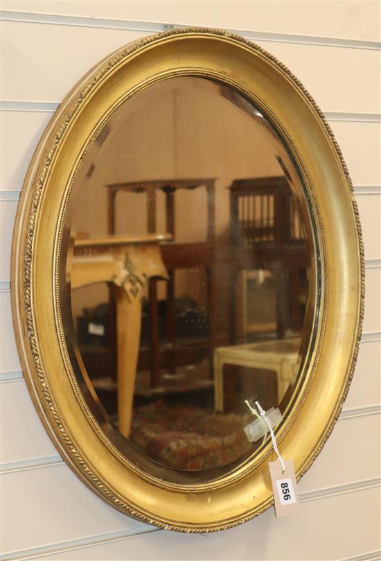 An oval gilt framed wall mirror H.60cm